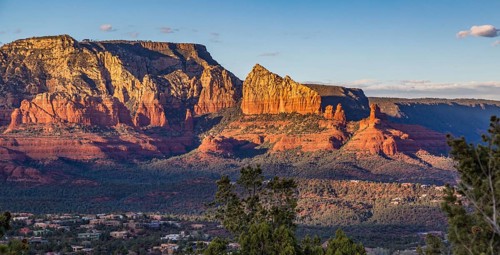 Evening sun lights up the red rock limestone formations surrounding Sedona, Arizona, USA, North