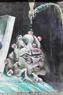 Graffiti on the Berlin Wall in the East Side Gallery, Berlin, Germany, Europe, Eerie plant-like