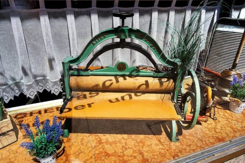 Shop window of a laundry with old mangle and washboard, Kempten, Allgaeu, Bavaria, Germany, Europe