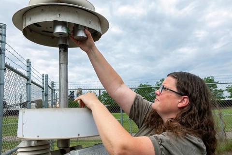 Dearborn, Michigan, Rebecca Robak, an environmental technician, checks air quality instruments at a