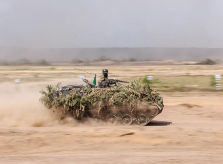 A German soldier on an M113 armoured transport vehicle, photographed during the NATO Steadfast