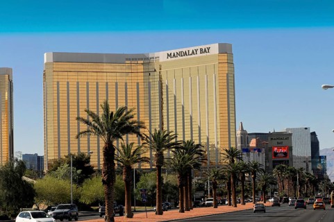 Las Vegas, Nevada, USA, North America, A street with several cars and the Mandalay Bay Hotel and