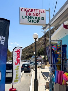 Sign advertising sign advertising at souvenir shop with lettering lettering reference to cigarettes