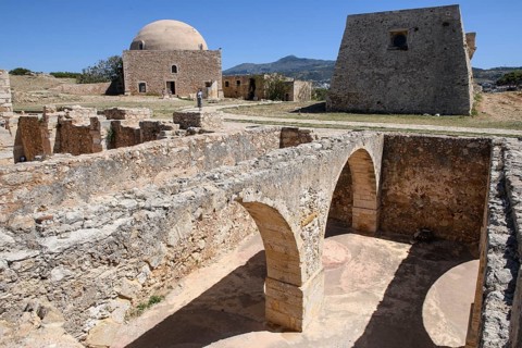 View of exposed walls columns in basement of former storage rooms of in ruins fortress ruins of