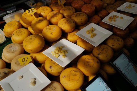 Dutch cheese on display in the town of Alkmaar on a market day., Alkmaar, The Netherlands, Europe