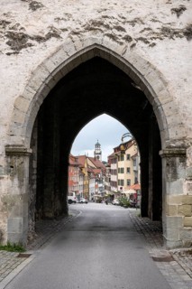 View through the Obertor, historic town gate along Marktstrasse to the Blaserturm tower in the old