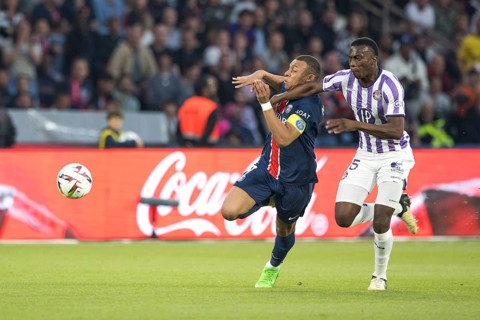 Football match, captain Kylian MBAPPE' Paris St. Germain left in a duel for the ball with Kevin
