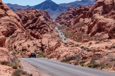 Traffic on Mouse's Tank Road winds between the red sandstone rock formations in Valley of Fire