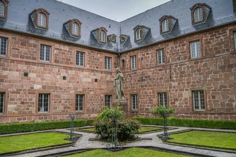 Inner courtyard with figure of St Odilia, Hohenburg Monastery, Odilienberg, Alsace, France, Europe