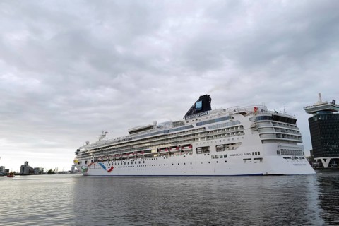 The medium-sized cruise ship the Norwegian Dawn, a ship belonging to the Norwegian Cruise Line,
