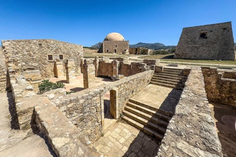 View of exposed walls columns of former storerooms and stairs to basement of old warehouse and