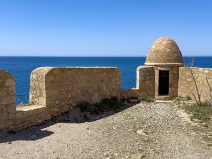 Round watchtower and wall with crenellated gap for guns one of 10 round watchtowers of historic