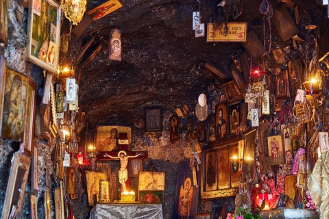 Rock Chapel, Archangel Michael Panormitits, Illuminated altar with a crucifix of Christ surrounded