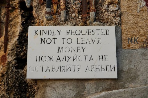 Rock Chapel, Archangel Michael Panormitits, A sign with the request not to leave money, in English