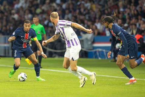 Football match, captain Kylian MBAPPE' Paris St. Germain left on the ball, a player of FC Toulouse