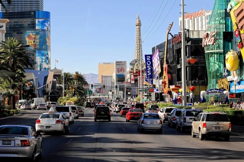 Las Vegas, Nevada, USA, North America, A busy street with cars and an Eiffel Tower replica as well