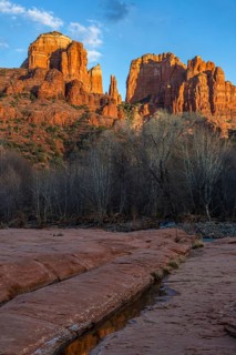 Cathedral Rock sandstone formations tower over Oak Creek at the Crescent Moon Picnic Site in