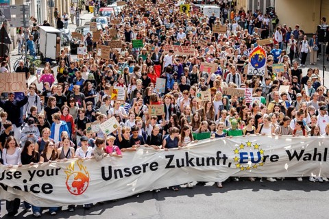 Demonstrators with signs at Fridays for Future, taken during the climate strike for the EU