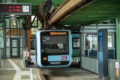 The Wuppertal suspension railway at Vohwinkel station waits for departure while the electronic
