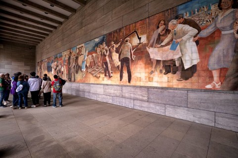 Tour group, tourist group, tourists on a guided city tour, mural Aufbau der Republik made of