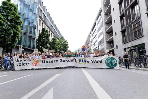 Demonstrators with signs at Fridays for Future, taken during the climate strike for the EU