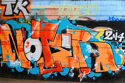 Barcelona, Catalonia, Spain, Europe, Graffiti with large, colourful lettering on a wall in an urban
