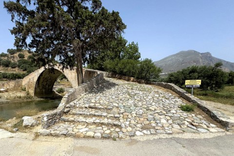 View of stairway with coarse cobblestones of historic classical arched stone bridge in Venetian