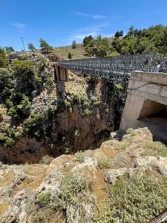 View from car park above Aradena gorge to steel girder bridge over gorge part of road from Anopolis