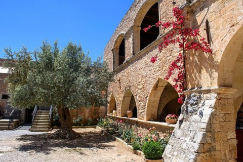 Interior of 1870 built building with arched openings to the courtyard on the site of the west gate