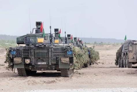 Cougar infantry fighting vehicles are camouflaged and deployed as part of the NATO Steadfast