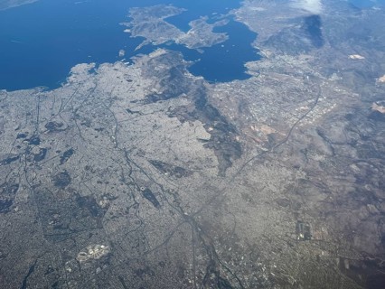 Aerial view from high altitude Overview of the city of Athens, bottom left in the picture Olympic
