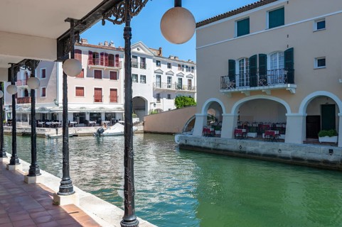 Townscape with restaurants at the Pont principal du port grimaud, Port Grimaud, Var,