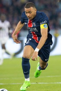 Football match, captain Kylian MBAPPE' Paris St Germain energetically running after and leading the