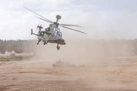 A Cougar infantry fighting vehicle and two Tiger combat helicopters, photographed during the NATO
