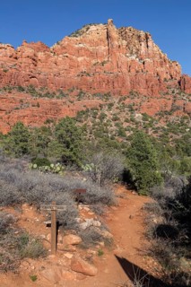 Trail marker sign for the Chapel Trail through red rock sandstone formations in Sedona, Arizona,