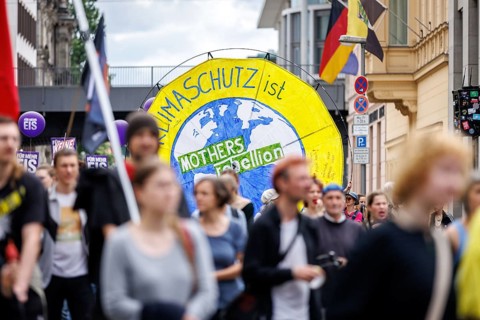 Demonstrators with signs at Fridays for Future, taken during the climate strike for the EU