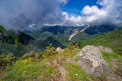 Mountain panorama from Passo Croce in the Garfagnana mountain landscape to the cloudy peaks of the