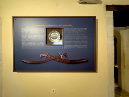 Display case with information on the siege of Arkadi Monastery by the Ottoman Empire in 1866 in the