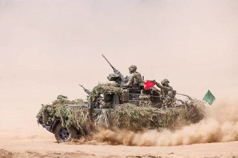 Dutch soldiers on a camouflaged Serval during the NATO Steadfast Defender large-scale manoeuvre in