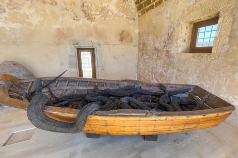 Photo of artwork by Museum of Contemporary Art Refugee boat of migrants and seven snakes made of