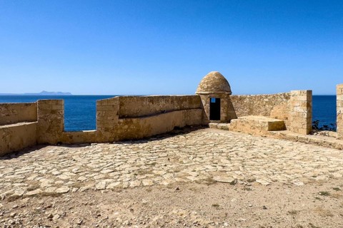Round watchtower and wall with crenellated gap for guns one of 10 round watchtowers of historic