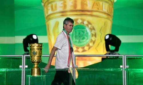 Coach of 1. FC Kaiserslautern Friedhelm Funkel walks past the cup in disappointment, 81st DFB Cup