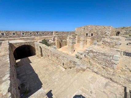 View of left access to former auxiliary gate casemates storage right basement wall remains columns