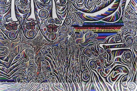 Graffiti on the Berlin Wall in the East Side Gallery, Berlin, Germany, Europe, Close-up of an