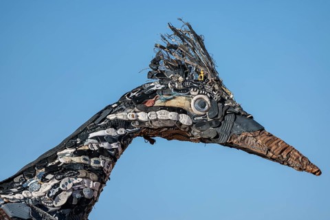 Close up of Recycled Roadrunner statue made entirely from discarded materials by artist Olin Calk