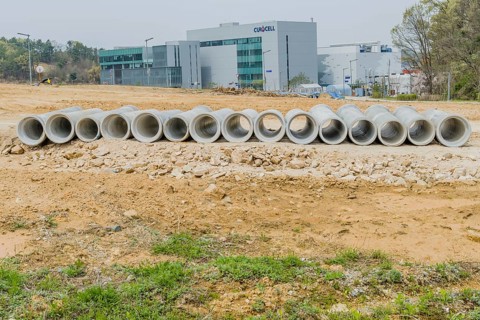 Row of concrete culvert pipes on ground at construction site in Daejeon, South Korea, Asia