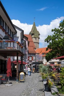 Pedestrian zone at Holzmarkt with the green tower in the historic old town of Ravensburg, district