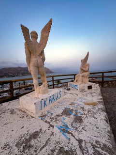 Photo taken at dusk evening mood of monument to Daedalus and Icarus on cliff of flight for flight