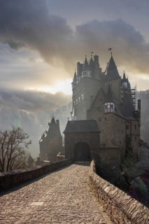 View of Eltz Castle. A landscape in autumn on a frosty morning with ripe and fog. The famous castle