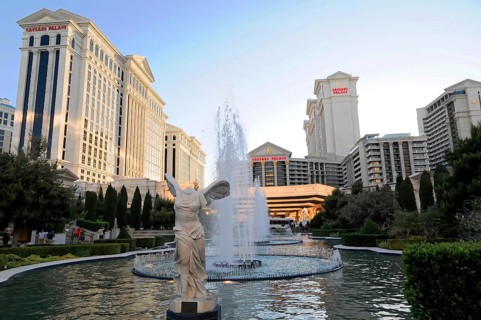 Las Vegas, Nevada, USA, North America, Impressive buildings and a large fountain illuminated by the
